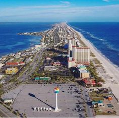 an aerial view of the beach and hotels