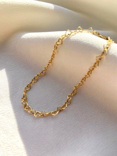 Delicate 14kt gold filled heart chain bracelet. The delicate and minimalist design of this link bracelet goes well with both casual and sophisticated looks. Wear it on its own or layered with other bracelets in our shop. Perfect for a gift! ✦ MATERIALS ✦ 14kt gold filled heart chain and lobster claw clasp. ✦ SIZING ✦ Available in 3mm width. ✦ PACKAGING ✦ All orders are packed in jewelry boxes/pouches with a brand logo, which makes it perfect for gifting. All packaging materials including mailers Delicate Heart Bracelet With Delicate Chain, Trendy Gold Heart Bracelet With Chain, Dainty Chain Bracelet For Valentine's Day, Dainty Heart Bracelet With Delicate Chain For Valentine's Day, Dainty Gold Plated Heart Bracelet, Minimalist Heart Bracelet With Delicate Chain For Gift, Delicate Heart Bracelet With Delicate Chain For Everyday, Delicate Heart Bracelet With Chain For Everyday Wear, Gold Bracelet With Delicate Chain For Valentine's Day