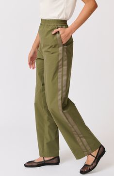 DESCRIPTION Embrace effortless style and comfort with the Milly Pant in Thyme by Cartel & Willow. These high-waisted pants are designed with a relaxed fit and feature an elastic waistband for ultimate comfort. The earthy thyme colour and subtle side stripe detailing add a modern twist to a classic silhouette. Perfect for both casual days and laid-back weekends, these pants are versatile enough to take you from brunch to beachside walks with ease. Pair the Milly Pant with a simple white tank top Style Pant, Cargo Style, Simple White, Side Stripe, Classic Silhouette, 2024 Collection, White Tank Top, White Tank, Skirt Pants