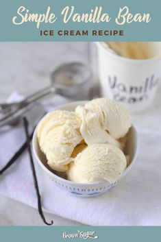 an ice cream recipe in a bowl with spoons next to it and the words, simple vanilla bean ice cream recipe