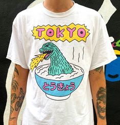 "High quality heavy cotton T-shirt. Designed by London based illustrator Gabriel Hollington. Model in the photo is 6\"1 and wearing a size L." Illustration Design Graphique, Vintage Pop, Shirt Design Inspiration, Cartoon Dinosaur, Tokyo Fashion, Design Graphique, Dinosaur Print, Tee Design, Printed Tees