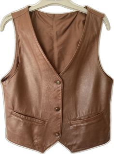 Brown Business Vest For Fall, Classic Sleeveless Leather Vest, Vintage Business Vest For Fall, Brown Leather Vest For Workwear, Classic Leather Vest For Workwear, Vintage Leather Vest Outerwear, Classic Fitted Leather Vest, Leather Work Vest With Pockets, Leather Workwear Vest With Pockets