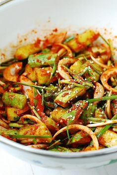 a white bowl filled with stir fried vegetables