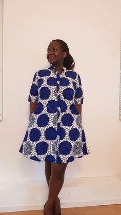 You will stand out in our Cornflower dress! Our loose fit colourful dresses made out of non-stretchy African print are perfect for you in case you are looking for a style idea that is versatile, comfortable, and looks fabulous year-round. All materials used to design the dresses are sourced in Kenya.  MEASUREMENT GUIDE:  We recommend asking questions about sizes or you can take your own measurements (at the bust) if unsafe. Since its an A- Line, you only need to ensure that you have the right fi Loose Ankara Dresses, Patterned Printed Short Sleeve Dress, Cotton Half Sleeve Dress With Pockets, Multicolor Short Sleeve Dress With Pockets, Casual White Dress With Vibrant Print, Cotton Tunic Dress With Pockets, Short Sleeve Printed Dresses With Relaxed Fit, Printed Short Sleeve Relaxed Fit Dresses, Cotton Mini Dress With Printed Short Sleeves