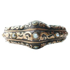 This Great old bangle bracelet, hand- made in Europe by very skilled jeweler, ca. 1880s - 1920s. Composite construction with frontal parts made of Silver on solid 14K Yellow and Rose Gold. Carved floral ornamentation Pearls mounted in three rows. The V- lock is very secure and firm that close with distinctive loud click sound.One wired security closure makes it extra safe to wear. Anatomically correct construction, this bangle will fit the wrist very comfortably and will not twist around. Not ha Luxury Antique Filigree Bangle, Elegant Bronze Bangle Bracelet, Antique Yellow Gold Hallmarked Cuff Bracelet, Antique Hallmarked Yellow Gold Cuff Bracelet, Elegant Antique Gold Bangle, Antique Gold Bangle Bracelet, Elegant Antique Gold Bangle Bracelet, Bronze Bangle Bracelet For Wedding, Bronze Bangle Bracelets For Wedding