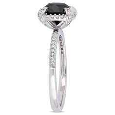 a black and white diamond engagement ring with diamonds on the sides, set in 18k white gold