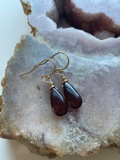 Such a unique and gorgeous stone! Bright glowly garnet hangs from gold filled or sterling silver ear wires 30mm drop Brown Long Drop Earrings For Gift, Amber Wire Wrapped Drop Earrings, Nickel-free Teardrop Spiritual Jewelry, Spiritual Teardrop Nickel-free Jewelry, Wire Wrapped Long Drop Earrings For Everyday, Handmade 14k Gold Filled Long Drop Jewelry, Everyday Wire Wrapped Long Drop Earrings, Amber Garnet Jewelry Gift, Amber Garnet Jewelry As Gift