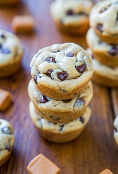 several chocolate chip cookies stacked on top of each other with one cookie in the middle