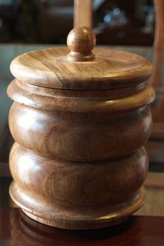 a wooden container sitting on top of a table