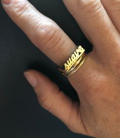 "Have a little fun and take your bling to another level with the Suave word ring. Stack it with other smaller rings. Pair it with other word rings like this one: https://www.etsy.com/listing/1063378702/rico-word-ring-rico-rich-word-ring?ref=shop_home_active_1&frs=1 word length: 16mm word height: 3 mm word width: 4 mm shank width: 1.5 mm This ring can be cast in brass, silver, or 14k gold plated over silver. If you are interested in solid gold please message me and we can discuss pricing. Love it Jewelry Latina, Word Rings, Nameplate Ring, Latina Jewelry, Word Ring, Spanish Words, Ring Stack, Small Rings, Ring Gold