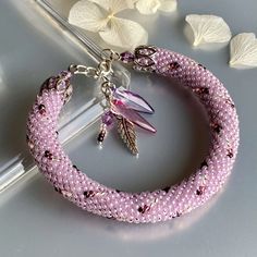 Bright  purple crystal beads bracelet, Crochet beaded bracelet, Bright colors bracelet  This tender bracelet elegantly sneaks on knits and silks, on coats and skimpy dresses, whenever and wherever she wants. As long as it is close to us in our sweetest adventures, colored in cotton candy and fabulous pastels  〰️〰️〰️〰️〰️〰️〰️ ✔️Bracelet  made of Japanese crystal beads and silver fittings. ✔️The colors are sweet , mesmerizing, luxurious, but at the same time quite unpretentious. * ORIGINAL DESIGN Elegant Lavender Beaded Bracelets With Faceted Beads, Handmade Pink Crystal Elegant Bracelet, Elegant Lavender Beaded Bracelet With Faceted Beads, Handmade Pink Crystal Bracelet For Wedding, Handmade Elegant Pink Crystal Bracelet, Elegant Handmade Pink Crystal Bracelet, Purple Beaded Bracelets For Wedding, Elegant Lavender Bracelets With Faceted Beads, Elegant Beaded Lavender Bracelets