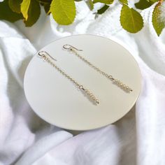 The Emma- 💙14k Gold Filled Ball Hook 💙14k Dainty Cable Chain 💙3inch Drop 💙6 Tiny, Dainty Freshwater Pearls Why choose Gold Filled?  Gold filled jewelry contains about 100 times the amount of gold than a gold plated item. The gold is fused to the base metal using pressure and high heat so it will never flake or peel. Gold filled products will not tarnish under normal circumstances. If necessary, you can clean the necklace gently with a soft cloth. Keep harsh chemicals away such as sunscreens, lotions, perfumes, soaps etc. Hypoallergenic 14k White Gold Filled Jewelry, Nickel-free 14k White Gold Jewelry, Hypoallergenic Gold Linear Earrings In Sterling Silver, Hypoallergenic 14k Gold Silver Earrings, Tarnish Resistant Dangle Linear Earrings Gift, Gold Hypoallergenic Linear Earrings For Anniversary, 14k Gold Silver Jewelry With Pearl Drop, Minimalist Sterling Silver Tarnish Resistant Linear Earrings, Minimalist Tarnish Resistant Sterling Silver Linear Earrings