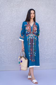 "This beautiful bohemian embroidered tunic dress is surely going to add life and oriental charm to your closet. The dress is made of Egyptian cotton which is widely renowned for its quality and texture. The dress is light and extremely soft and can be used on many occasions - beach, lounge, or even in your home to feel comfortable. Fabric : 70% Egyptian Cotton; 30% Polyester. Tunic measurements in inches : Small (Size 4/6 USA) Bust : 36-37 Hip : 40-41 Medium (Size 8/10 USA) Bust : 39-40 Hip : 45 Traditional V-neck Boho Dress For Spring, Blue V-neck Dress With Resham Embroidery, Eid Embroidered Straight Kurta Dress, Festive Tunic Kaftan With Embroidered Neckline, Blue Embroidered Straight Kurta Kaftan, Eid Straight Kurta Dress With Multicolor Embroidery, Eid Multicolor Embroidered Straight Kurta Dress, Eid Multicolor Embroidery Straight Kurta Dress, Blue Straight Kurta Tunic For Spring