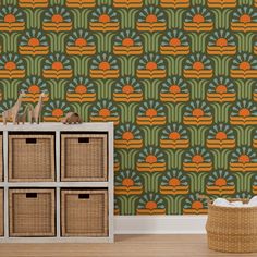 an orange and green wallpaper in a room with baskets on the floor next to it