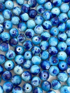 blue and white beads with holes in the middle