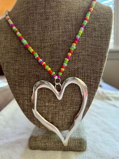 Built around the song Light my love This necklace is made with love for the band Greta Van Fleet, necklace length is about 17-19 inches, made with glass e beads and large metal heart charms Greta Can Fleet Jewelry, Jake Kiszka Necklace, Josh Kiszka Necklace, Heart-shaped Glass Necklace, Greta Van Fleet, Multicolor Heart-shaped Glass Necklaces, Aesthetic Gift, Boho Aesthetic, Metal Heart