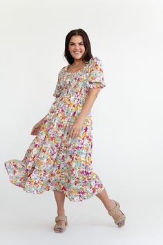 Features Square neck Balloon sleeve with elastic Smocked bodice Ruffled tiered skirt with pockets Vibrant floral print Skirt is lined Dress: 100% Rayon,Lining: 100% polyester Size + Fit Small 0-4, Medium 4-8, Large 8-12 Kristin is 5'4" a size 3 and is wearing a small Runs true to size Size Bust Length Small 34" 42" Medium 36" 43" Large 38" 44" Floral Embroidery Dress, Sage Dress, Gathered Dress, Bridesmaid Outfit, Floral Print Skirt, Skirt With Pockets, Night Out Dress, Floral Dress Summer, Embroidery Dress