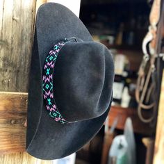 This hand-beaded hatband is the perfect accent to your favorite straw, felt, or fashion hat! This piece is so versatile, it can be worn as a necklace, headband, or even a wrap bracelet!  -1in wide  -Fits hat size 6 7/8 and up -Handmade with matte black, turquoise/teal, purple, and metallic gunmetal glass beads -Finished with black deer buckskin leather and tie Handmade on the Central Coast of California Adjustable Felt Hat With Short Brim, Bohemian Adjustable Felt Hat, Handmade Adjustable Felt Hat For Western Events, Adjustable Felt Fedora Hat Bands, Adjustable Felt Hat Band For Fedora, Adjustable Beaded Fedora Hat Band, Adjustable Felt Hat With Flat Crown, Traditional Beaded Hat Bands For Country Events, Adjustable Flat Crown Felt Hat