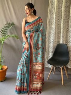 Delightfully produced from pure malai cotton, this sky-blue saree with a classic contrast blouse is a must-have addition to your ethnic wear collection. The vibrant kalamkari prints on the saree add a touch of excitement and uniqueness, making it stand out from the crowd.
The intricate detailing of the print, combined with the serene sky-blue hue, gives this saree a timeless aesthetic appeal. It exudes elegance and sophistication, perfect for any occasion. The ensemble is reminiscent of clear su Kalamkari Prints, Tassels Blouse, Royal Blue Saree, Sky Blue Saree, Kalamkari Print, Kalamkari Designs, Kalamkari Blouse, Kantha Sarees, Purple Weave