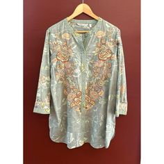 Soft Surroundings Floral Embroidered Bohemian Top Easy Care Machine Wash Casual Elevate your wardrobe with this exquisite Soft Surroundings tunic top. The intricate floral embroidery adds a touch of elegance, making it a standout piece for any collection. * Floral embroidery * 3/4 sleeves * Button-front closure * Lightweight fabric * Comfortable fit Style: Cottage Core, Bohemian, Boho Chic, Easy Care, Machine Wash Content: Cotton Washing Instructions: Machine Wash Measurements: Armpit to armpit: 23" Back of Collar to Bottom Hem: 32" The item has been laundered according to garment specifications. We ship most items out the next business day. Please contact us with any additional questions. We are happy to combine shipping when possible. Thank you! 2474 Features: * Cottage Core, Bohemian, B Spring Festival Printed Blouse, Spring Festive Printed Blouse, Casual Long Sleeve Tunic With Printed Motifs, Patterned Long Sleeve Floral Tunic, Long Sleeve Floral Print Patterned Tunic, Bohemian Floral Print Blouse For Festive Season, Floral Print Tops For Spring Festive Season, Spring Long Sleeve Kaftan With Floral Embroidery, Spring Tunic Blouse With Resham Embroidery