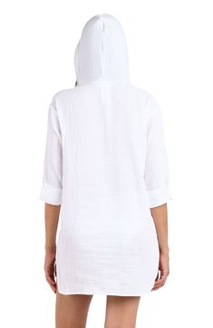 With all the same cozy comfort of your favorite hoodie, this swimsuit cover-up is perfect for throwing on post dip (or after the sun sets). The open neck sans drawstring makes for easy ons and offs and a longer length in back provides all the coverage you need. A kangaroo pocket keep your hands warm but can also hold small items like keys or sunscreen. [split] Details Hooded tunic Open neck Kangaroo pocket Longer length in back Fabric 100% Cotton Summer Vacation Cotton Hoodie, White Cotton Beach Hoodie, Cotton Hoodie For Summer Vacation, White Cotton Hoodie For Beach, White Cotton Hoodie For The Beach, Casual Beach Season Hoodie Tops, Relaxed Fit Long Sleeve Top For Beach Cover-up, Casual Beach Hoodie Top, Casual Hoodie Tops For Beach Season