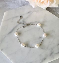 Classy and timeless, this glowing pearl bracelet can complete the most sophisticated of bridal looks. Excellent quality cultured pearls (10-11mm teardrop) are paired with sterling silver (marked 925) for a simple, but very elegant look. Length: 7.5" (approx. 19cm) with a 2" (approx. 5cm) extension chain for comfortable sizing. Closure is a secure spring ring clasp. Available in three beautiful colors: White, Blush and Mauve. To choose your desired color select from the dropdown menu. This beauti Pearl Bracelet With Pearl Charm For Formal Occasions, Adjustable Pearl Bracelet With Pearl Pendant For Wedding, Elegant Hypoallergenic Jewelry With Round Beads, Classic Pearl Bracelet With Pendant For Formal Occasions, Silver Pearl Drop Bracelet As Gift, Adjustable Sterling Silver Pearl Drop Bracelet, Silver Pearl Bracelet With Pearl Drop For Gift, Silver Pearl Bracelet With Pearl Drop As Gift, Elegant Adjustable Bracelet With Pearl Pendant