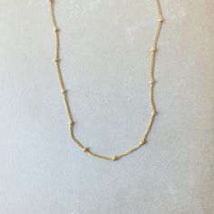 Our Satellite Chain Necklace is dainty and adds just a bit of texture. A perfect everyday necklace that looks lovely on its own and can easily layer with your other favorite necklaces. Dainty Link Chain Necklace With Clavicle Chain, Dainty Station Necklace With Delicate Chain As Gift, Dainty Clavicle Link Chain Necklace, Dainty Everyday Necklace With Chain, Minimalist Everyday Clavicle Chain Necklace, Minimalist Charm Necklaces With Delicate Chain Choker, Dainty Chain Layered Necklace For Everyday, Simple Choker Necklace With Adjustable Chain, Dainty Everyday Necklace With Beaded Chain