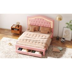 a bed with pink headboard and drawers in a room next to a rug on the floor