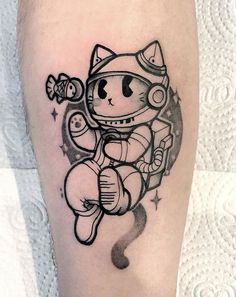 a black and white tattoo of an astronaut cat holding a balloon in its paws, on the leg