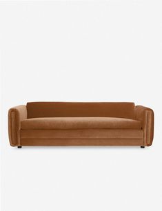 a brown couch sitting on top of a white floor