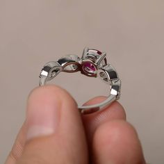 This is a gorgeous handmade creation. Its beauty is its simplicity & Elegance. The 7*7 mm round shape faceted lab Ruby is crafted in solid sterling silver and with rhodium plated. Main stone weight about 1.66 ct. cz as accents. All item is sent in a beautiful gift box If you have any idea of design your ring,pls contact me directly. You can realize more lovely stuff clicking the link https://www.etsy.com/shop/knightjewelry?refshopsection_shophome_leftnav Please leave the correct address and Sterling Silver Round Cut Ruby Wedding Ring, Exquisite Silver Round Ruby Ring, Silver Birthstone Ring With Round-cut Lab-created Ruby, Luxury Sterling Silver Ruby Ring With Round Cut, Ruby Cocktail, Silver Ruby Ring With Hallmark, Round Cut, Rings Red, Cut Rings, Ruby Rings