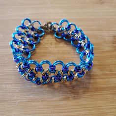 Hand Crafted, Metal Chain Mail Bracelet In Teal, Purple, And Brass. Brand New, Never Worn. Measures 7.5" Long And Just Under 1" Wide. Perfect For Your Next Ren Faire! Body Lace, Chainmail Bracelet, Chain Maille, Chain Mail, Jewelry Designs, Metal Chain, Womens Jewelry Bracelets, Blue Purple, Blue And Purple