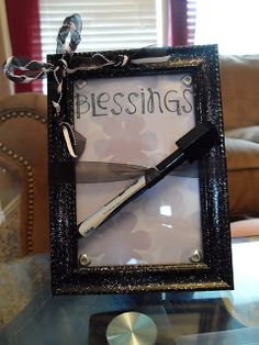 there is a glass frame with a knife in it and the words piecings on it