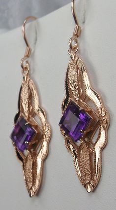 "Natural Amethyst Earrings Star Design#E6 Custom Made These are Victorian era reproduction earrings (Made from and Antique brooch) in sterling silver set with flawless high quality natural purple amethyst gemstones. Each stunning 1ct Amethyst is 6mm long/wide (1/4th\"). The earrings are 1 3/4th inches long and 14mm (1/2\") at its widest point. Notice the beautiful leaf on the bottom and top of the setting. These lovely earrings were fashioned from an antique Victorian floral brooch. A gift box i Ornate Purple Jewelry With Matching Earrings, Ornate Purple Dangle Earrings, Ornate Purple Drop Earrings, Purple Earrings With Intricate Design For Gift, Purple Earrings With Intricate Design As Gift, Ornate Purple Dangle Jewelry, Ornate Purple Pierced Earrings, Elegant Purple Jewelry With Ear Wire, Elegant Purple Pierced Jewelry