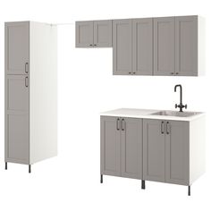 a white sink sitting under two gray cabinets