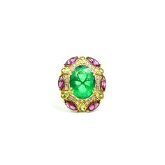 Inspired by traditional Victorian floral patterns, this ring features a magnificent oval diamond-cut emerald gemstone as its centerpiece. The emerald rests upon a grapevine-like structure adorned with radiant pear-shaped peridot and deep red marquise-shaped Rhodolite garnet. The intricate design is set on a yellow gold-plated Sterling Silver band, exuding timeless elegance and vintage charm. Technical Specifications -Gemstones: Emerald (Natural Coated), Peridot, Rhodolite, White Zircon -Metal: S Fine Jewelry Emerald Green Oval Cabochon Ring, Exquisite Oval Emerald Ring, Green Oval Cabochon Emerald Ring, Luxury Oval Emerald Gemstones, Oval Emerald Ring With Diamond Gemstone Accents, Exquisite Oval Green Emerald Ring, Oval Multi-stone Emerald Gemstones, Exquisite Green Oval Emerald Ring, Formal Oval Emerald Ring With Gemstone Accents