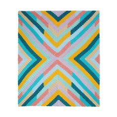 a multicolored knitted rug with an abstract design on the front and back