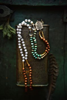 "This smaller size (6mm) mala necklace is made with a powerful combination of white Moonstone, green Chrysoprase, Citrine, tribal brass and slightly fragrant Sandalwood beads. It's finished with an artisan bronze Tree of Life pendant (Crescent Moon on the back side). This delicate and earthy piece is great for new beginnings..! Total necklace length is about 36 inches - the pendant reaches the Solar Plexus on a medium height person. It's lightweight and comfortable to wear everyday - last pictur White Jade Jewelry For Meditation, Bohemian Agate Mala With Gemstone Beads, Spiritual Hand-strung Jade Beaded Necklace, Handmade White Jade Beaded Necklaces, Bohemian White Jade Necklaces, Nature-inspired White Necklace With Natural Stones, Meditation Beaded Necklace With Natural Stones, Bohemian Aventurine Beaded Necklaces, Spiritual Jade Beaded Necklaces For Meditation