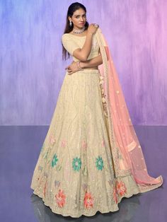 Add a touch of elegance and grace to your ethnic wardrobe with our captivating off-white sequins net lehenga choli with dupatta. This exquisite ensemble is meticulously crafted with intricate sequin and embroidered work, showcasing the richness of Indian craftsmanship.
Designed in an off-white color, the net material lehenga exudes a sense of purity and radiance. The sequins and embroidered work further enhance its beauty, adding a glamorous touch to the overall look. The semi-stitched lehenga c Cream Semi-stitched Lehenga For Reception, Off White Lehenga For Reception And Navratri, Festive Floor-length Beige Lehenga, Festive Floor-length Cream Choli, Festive Cream Choli, Cream Lehenga For Diwali Reception, Cream Lehenga For Reception Diwali Festival, Cream Lehenga For Reception And Diwali, Festive Cream Lehenga For Reception