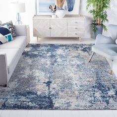 a living room with blue and white decor