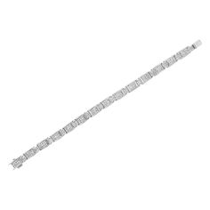 Elegant and timeless, this gorgeous 14K white gold alternating station tennis bracelet features 5.0 carat total weight of invisible set, princess cut diamonds with a whopping 252 stones in all. The tennis bracelet features alternating small and large hinged rectangular links inset with rows of square diamonds. The 7Ã¢â‚¬Â bracelet fastens with a box with tongue clasp. This authentic design is crafted of real 14 karat gold, a precious metal that will keep a tarnish-free shine for years to come. White Platinum Diamond Jubilee Bracelet, Classic Brilliant Cut Diamond Bracelet, White Platinum Jubilee Diamond Bracelet, Rectangular Diamond Cut Tennis Bracelet, Silver Diamond Bracelet With Baguette Diamonds, Timeless White Diamond Platinum Bracelet, Timeless White Diamond Bracelet In Platinum, Classic Diamond Bracelet With Baguette Diamonds, Classic Rectangular Diamond Bracelet With Brilliant Cut