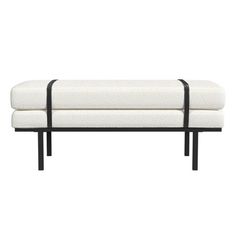 a white bench with black metal legs