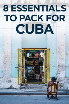 a man sitting on a chair in front of a building with the words 8 essentials to pack for cuba