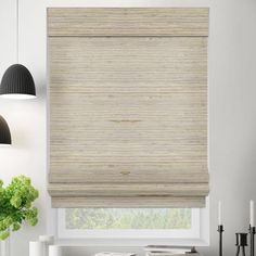 the blinds in this kitchen are made out of bamboo and have been pulled down to reveal an interesting pattern