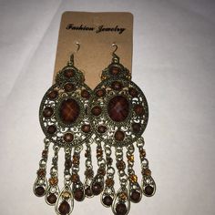 Bohemian Gold Tone Earrings Brown Bohemian Dangle Earrings, Nickel-free Brown Bohemian Earrings, Bohemian Dangle Clip-on Earrings For Party, Elegant Brown Chandelier Earrings, Bohemian Bronze Earrings, Bohemian Brown Pierced Earrings, Vintage Brown Dangle Jewelry, Bronze Metal Chandelier Earrings, Vintage Brown Beaded Dangle Earrings