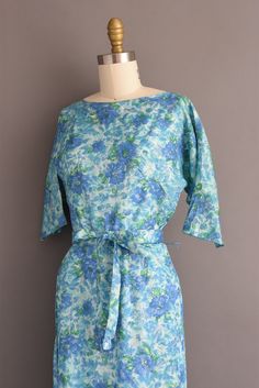 "Vintage 1950s cocktail party dress with a beautiful blue floral print throughout. This vintage dress features a flattering fitted bodice with bust darts, nipped waist, and a pencil skirt fit. Back metal zipper for closure. ✂------ M E A S U R E M E N T S ------- Best Fit: Small Bust: 34\" Waist: 25.5/26\" Hips: 35.5\" Shoulders: undefined Sleeves: 11.5\" Total Length: 41.5\" Material: silk Condition: Excellent vintage condition. Ready to wear. ☆ Layaway is available for this item! ☆ Express/Ove 1950s Cocktail Party, Vintage Dress Blue, Pencil Skirt Dress, Full Skirt Dress, 50s Dresses, Skirt Fits, Cocktail Party Dress, Blue Floral Print, Skirt Dress