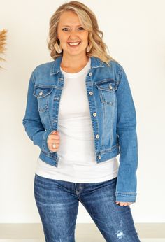 The one versatile item your closet needs is a great stone washed denim jacket to pair with all your favorite outfits for daytime and evening outings. Cropped style eatures two pockets and button front closure. Pairs perfectly with the Dreamer Tee or Essential Tee in any color. Shown with Kan Can Distressed Jeans and Kan Can Jeans or Linen Pants. 68% Cotton 26% Polyester 4% Rayon 2% Spandex 0-4 Small 5-9 Medium 10-12 Large Medium Wash Button-up Outerwear For Day Out, Button-up Medium Wash Outerwear For Day Out, Everyday Light Wash Denim Jacket With Button Closure, Stretch Outerwear With Pockets For Everyday, Medium Wash Button-up Denim Jacket For Day Out, Relaxed Fit Medium Wash Denim Jacket For Day Out, Everyday Light Wash Denim Jacket With Buttoned Pockets, Everyday Medium Wash Denim Jacket, Everyday Outerwear With Snap Buttons