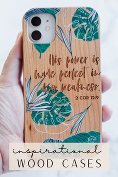 a person holding up a wooden phone case with the words inspirational wood cases on it