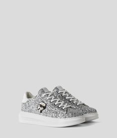 Silver Low-top Sneakers With Textured Sole, Streetwear Sneakers With White Sole And Metallic Logo, Silver Casual Sneakers With Metallic Logo, Silver Sneakers For Streetwear With Speckled Midsole, Silver Sneakers With Speckled Midsole For Streetwear, Low-top Textile Sneakers With Embroidered Logo, Casual White Sneakers With Foil Embossed Logo, High-top Textile Sneakers With Embroidered Logo, Casual Sneakers With Metallic Logo For Streetwear