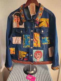 a denim jacket with pictures on it